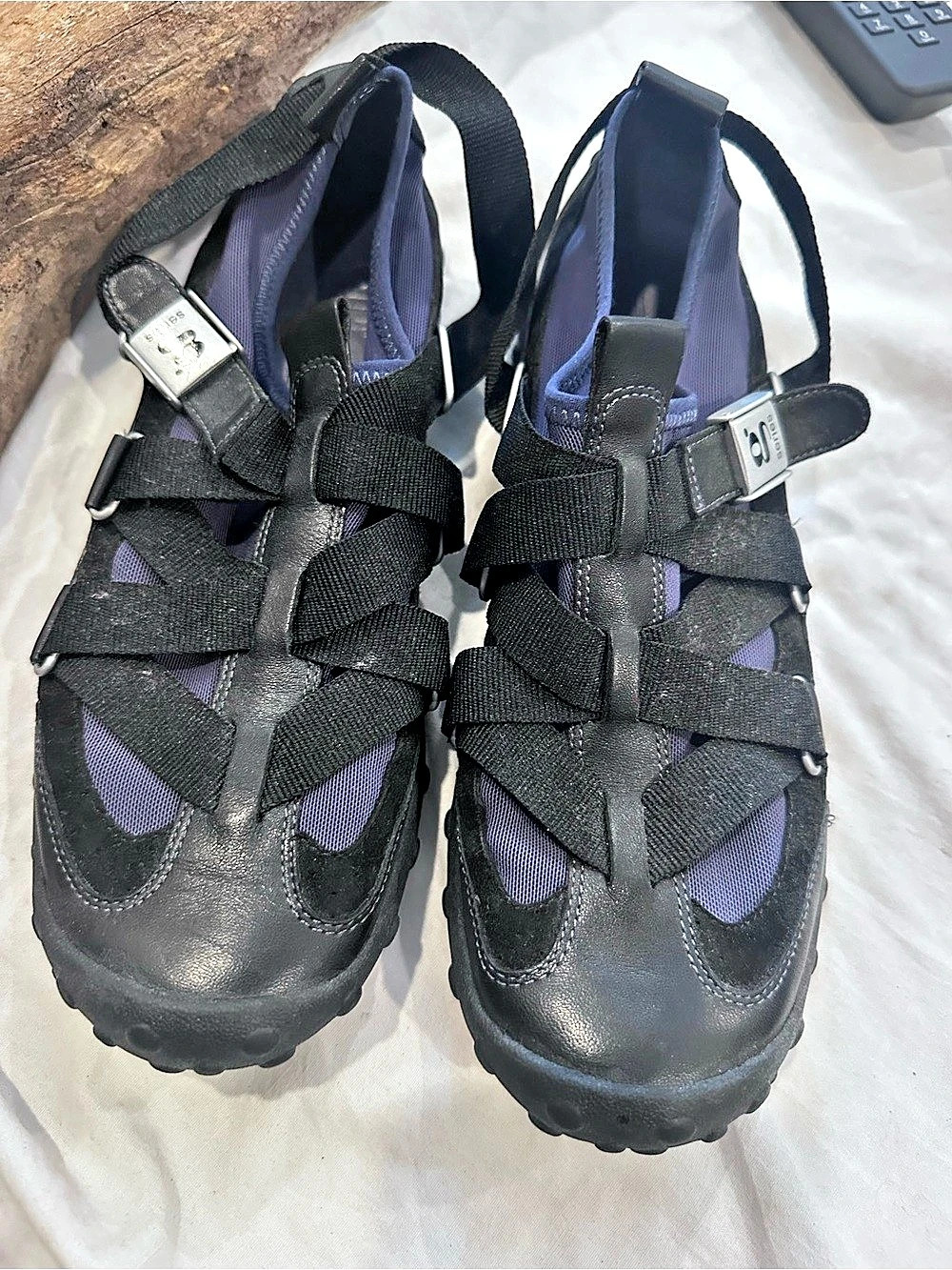 Nike Lab G Series trail shoes featuring a strap-and-buckle overlay system